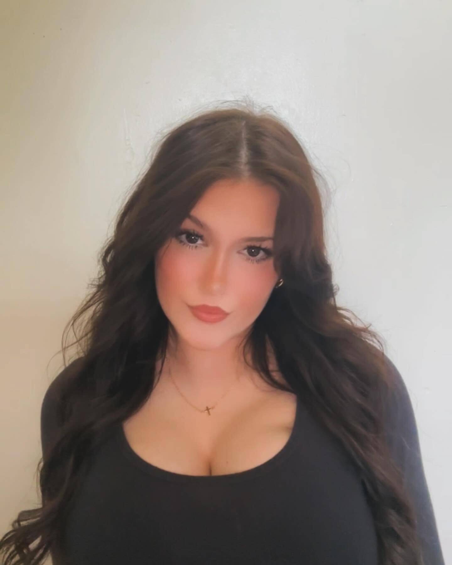 Girl posing in a white room